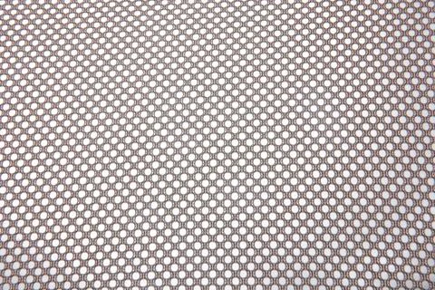 Close up of the mesh fabric pattern from the backrest of the chair. Stock Photos