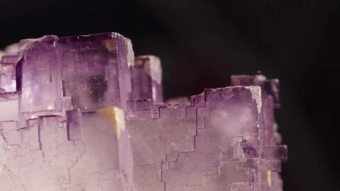 CLOSE UP Mesmerizing translucent violet prisms of semi precious fluorite mineral Stock Footage 84592416