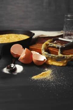 Close-up of messy kitchen counter with broken eggshells and kitchen utensils 스톡 사진