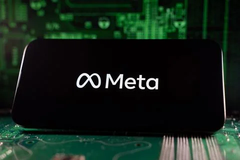 Close up of Meta logo on device with circuit board background. Toronto, Canada - Stock Photos