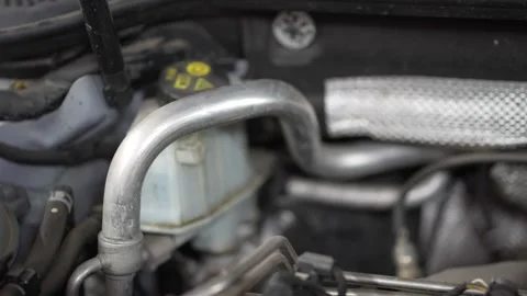 Close-up of a metal air conditioning pipe in engine bay. Stock Footage 345709217