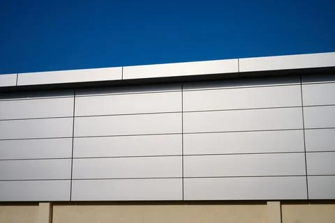 Close-up of the metal cladding facade of a modern building. Stock Photos