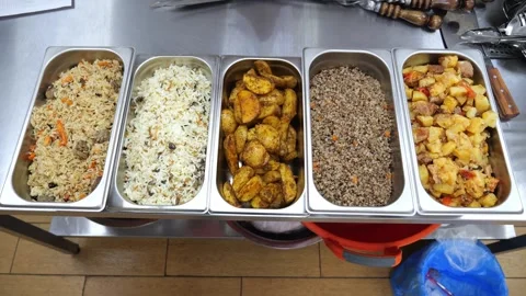 A close-up of metal containers with ready-made food in the dining room. Stock Footage 318138992