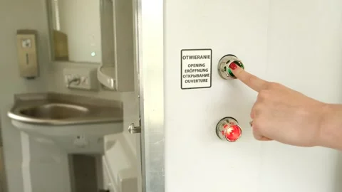 Close-up of a metal door on a train with a red and green light. Stock Footage 245098484