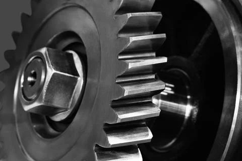 Close-up of metal gears  Interlocking teeth show precision engineering. Hexag Stock Photos
