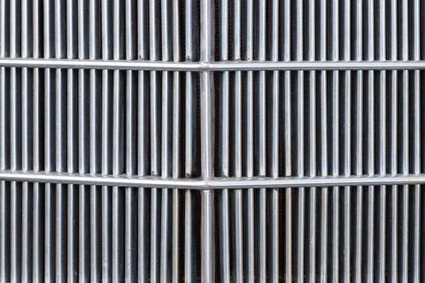 Close-up of metal grate with parallel vertical bars pattern Stock Photos