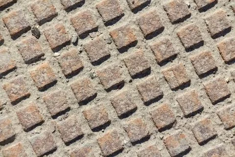 Close up metal grid pattern of manhole Stock Photos