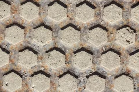 Close up metal grid pattern of manhole Stock Photos