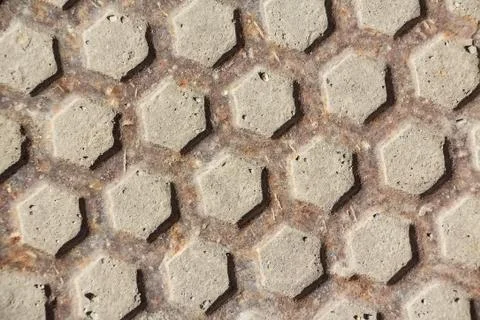 Close up metal grid pattern of manhole Stock Photos