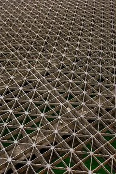 Close-up of metal grid structure with geometric pattern Stock Photos