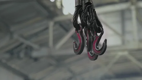 Close-up, Metal Hooks on Cables Hanging from the Bridge Crane in the Factory Stock Footage 158824110