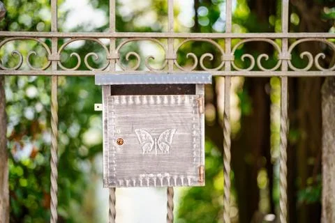 Close-up of a metal mailbox with a butterfly pattern on the gate, shallow depth Stock Photos