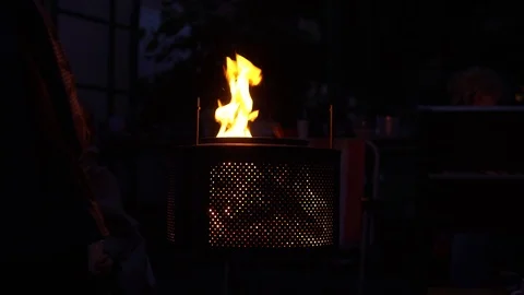 Close-up of metal mesh background lights fire on dark background, night. metal Video stock 91731307