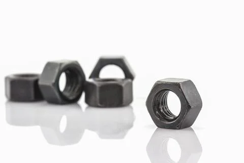 Close up Metal nuts on white background. Stock Photos