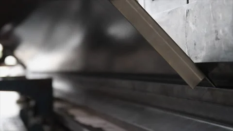 Close-up of metal panel bending process on a press brake Stock Footage 317254054