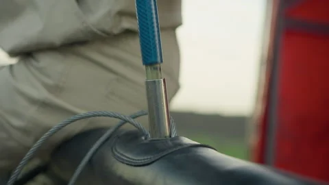 Close up of metal rod being aligned into basket fitting during setup process Stock Footage 317161723