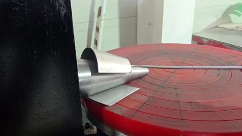 Close-up of Metal Rolling Machine Shaping Stainless Steel Cone Video stock 329909111