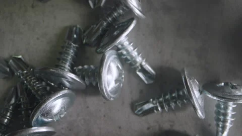 Close Up Metal Screws As Background Gray Surface For Commercial Use Video stock 333209354