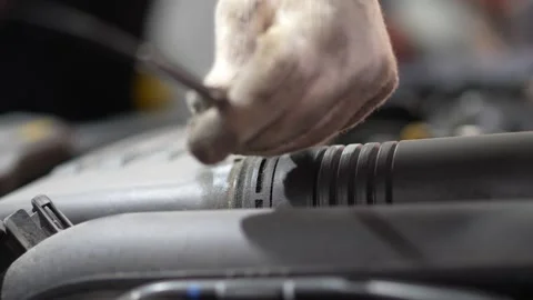 Close-up of a metal sensor clip on air intake pipe. Stock Footage 345709047