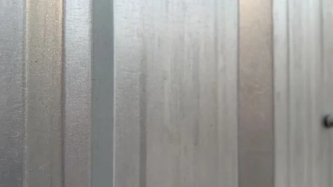Close-up of metal sheet wall texture with metallic corrugated patterns Stock Footage 312096198