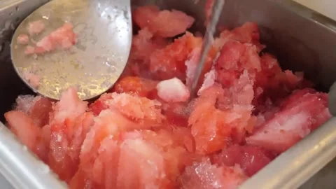 Close Up Of Metal Spoon Scooping Refreshing Strawberry Shaved Ice Dessert In Met Video stock 345692839