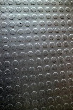 Close-up of metal surface with round bumps and textured pattern Stock Photos