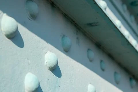Close-up of a metal surface with visible rivets. The industrial texture fea.. Stock Photos