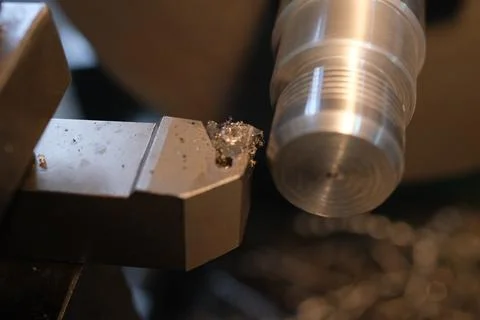 Close-up of Metal Threading Operation on a CNC Lathe with a Carbide Tool Bit Stock Photos