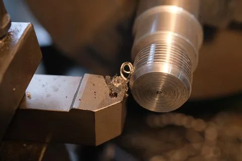 Close-up of Metal Threading Operation on a CNC Lathe with a Carbide Tool Bit Stock Photos