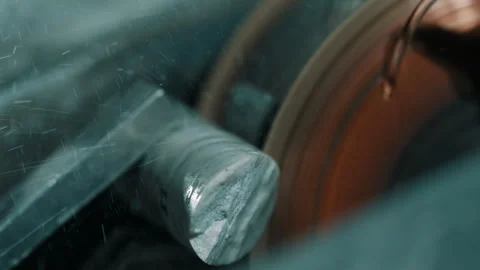 Close-up of Metal Tool on Spinning Grinding Wheel in Workshop Stock-Footage 337927142