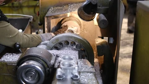 Close up of metal turning process on industrial lathe machine with flying s.. Stockbeeldmateriaal 333246200
