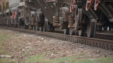 Close-up metal wheels of the train, which passes on rails of railway Stock Footage 117994312