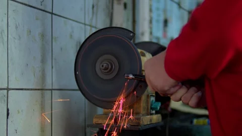 Close-up of a metal workpiece being processed on a grinding machine Stock Footage 310028330