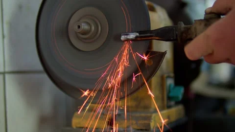 Close-up of a metal workpiece being processed on a grinding machine Stock Footage 310028357