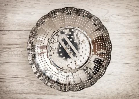 Close up of metallic circle strainer, kitchen equipment Stock Photos