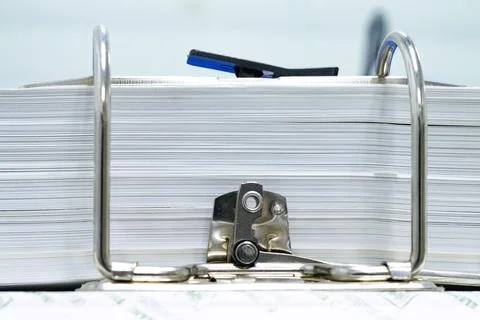 Close-up of a metallic of folder paper files with keeping various business Photos