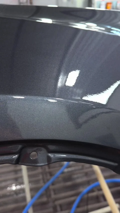 Close-up of metallic grey car paint finish with subtle glitter effect Stock Footage 341134620