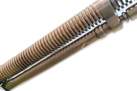 Close-up of metallic object with ridged cylindrical component, likely a mecha Stock Photos