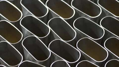 Close Up of Metallic Oval Tubes in a Grid Pattern Stock Footage 296564599