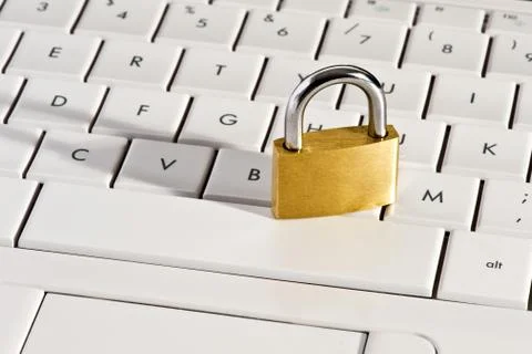 Close-up of a metallic padlock on a keyboard Stock Photos