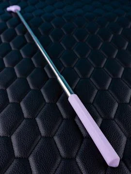 Close-up of a metallic pointer in the shape of a hand with the index finger o Stock Photos