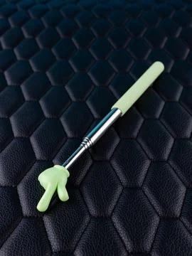 Close-up of a metallic pointer in the shape of a hand with the index finger o Stock Photos