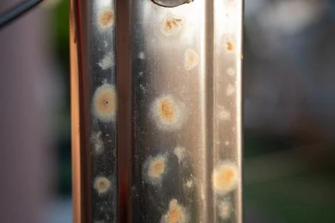 Close-up of a metallic surface displaying rust spots and corrosion marks, Stock Photos