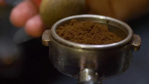 Close-up of metallic tempera in barist hands. Before tamping coffee. Stock-Footage 106468528