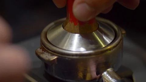 Close-up of metallic tempera. Preparing ground coffee with fresh coffee tamping Stock Footage 106468541