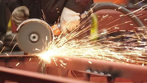 Close-up of metalwork processing at train car production plant. sparks fly Stock Footage 202049041
