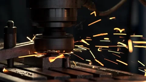 A close-up of a metalworking machine in action with sparks flying from the .. Stock Footage 329178841