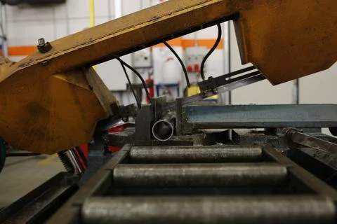 A close-up of a metalworking machine in operation, cutting through metal wi.. Stock Photos