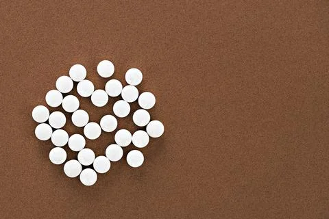 Close-up of methyl folate tablets, with negative space. dietary concept. Stock Photos
