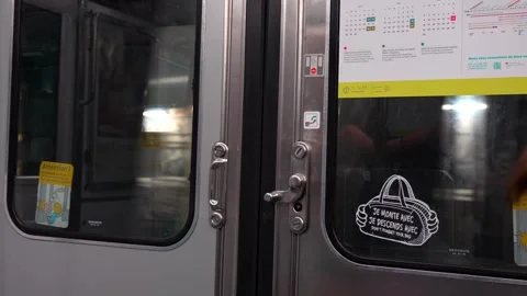 Close up of metro train doors with safety stickers Paris, June 15 2025 Stock Footage 311321482